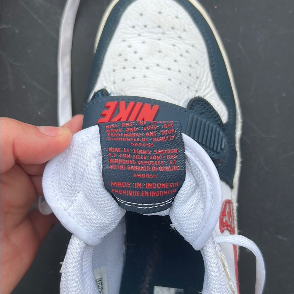 Nike White and Navy Sneakers with Classic Athletic Design